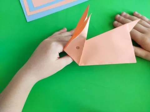 Origami step by step. How to make a paper bunny for Easter greetings Stock Photos