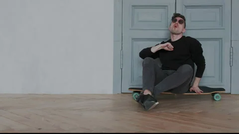 Original and authentic young guy in a cool sunglasses dancing, singing and have Stock Footage 107816978