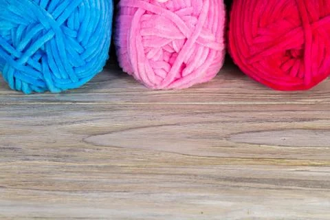 Original background with three colored tangles of yarn, thread for knitting Stock Photos