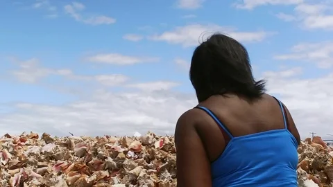 Original Bahama Mama Holding Conch Shell at Conch Shell Palace, Grand Bahama Stock Footage 108507059