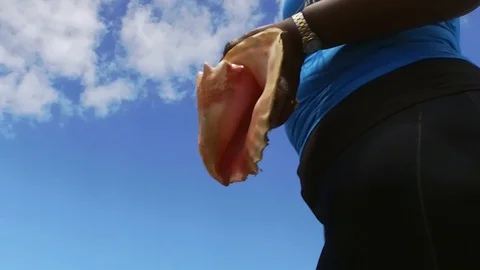 Original Bahama Mama Holding Conch Shell at Conch Shell Palace, Grand Bahama Stock Footage 108507967