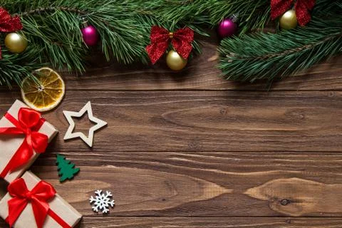 Original Christmas angled exposition with two gift box, snowflake, star, firtree Stock Photos