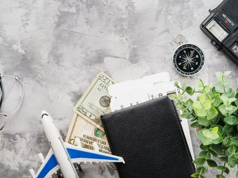 Original composition on a gray background. Attributes of travel, travel, air  Stock Photos