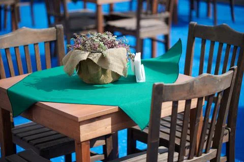 An original cozy place a table in the restaurant is waiting for its visitors Stock Photos