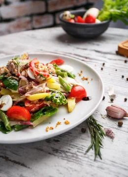 An original dish with decorations on a light background Stock Photos