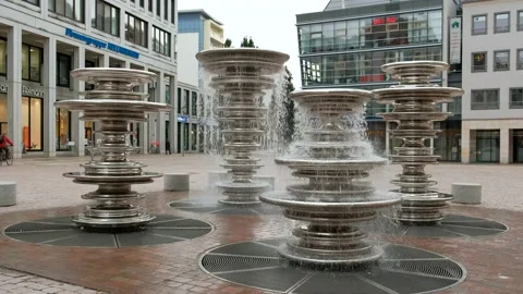 The original modern four-column stainless iron fountain near the  City Hall. Stock Footage 221552676