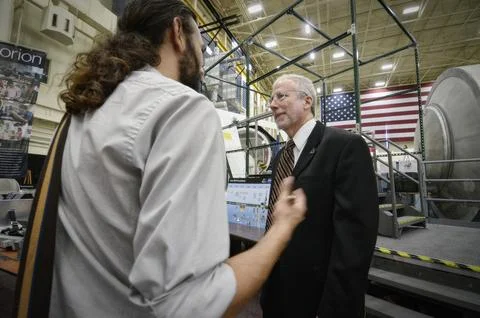 Orion Program Manager Mark Geyer tours the Orion mockups in Bldg. 스톡 사진