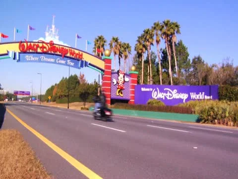 Orlando Florida Theme Park Main Gate News Footage of Cars on Road Trip Vacation Stock Footage 22243354