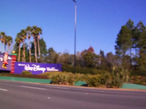 Orlando Florida Theme Park Main Gate News Footage of Cars on Road Trip Vacation Stock Footage 22243365