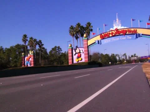 Orlando Florida Theme Park Main Gate News Footage of Cars on Road Trip Vacation Stock Footage
