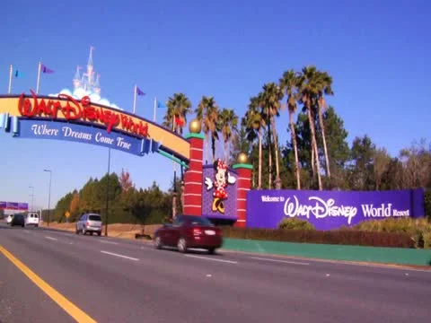 Orlando Florida Theme Park Main Gate News Footage of Cars on Road Trip Vacation Stock Footage 22243399