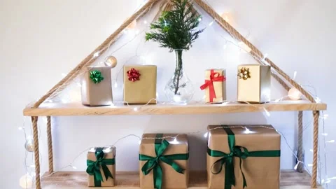 Ornament with lighting with pine tree decor from shelf and gift boxes lined up o Vídeo Stock 142075328