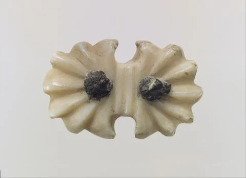 Ornament or button for harness ca. 9th7th century B.C. Assyrian This small .. Foto stock