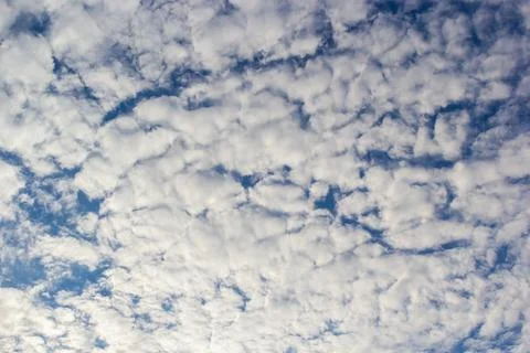 Ornamental clouds. Dramatic sky. Epic storm cloudscape Soft sunlight. Panoram Stock Photos