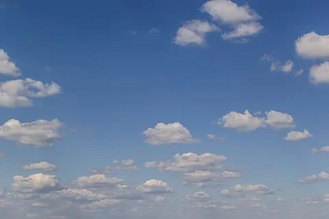 Ornamental clouds. Dramatic sky. Epic storm cloudscape Soft sunlight. Panoram Stock Photos