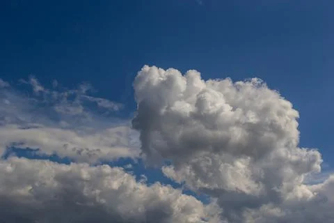 Ornamental clouds. Dramatic sky. Epic storm cloudscape Soft sunlight. Panoram Stock Photos