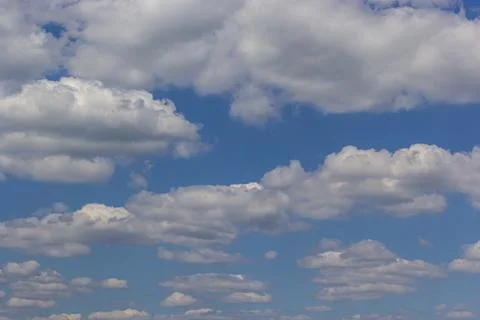 Ornamental clouds. Dramatic sky. Epic storm cloudscape Soft sunlight. Panoram Stock Photos