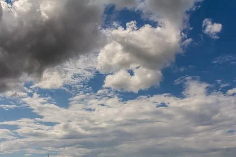 Ornamental clouds. Dramatic sky. Epic storm cloudscape Soft sunlight. Panoram Stock Photos