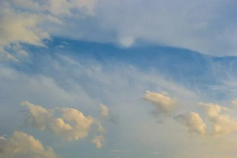 Ornamental clouds. Dramatic sky. Epic storm cloudscape Soft sunlight. Panoram Stock Photos
