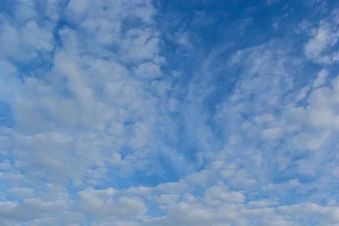 Ornamental clouds. Dramatic sky. Epic storm cloudscape Soft sunlight. Panoram Stock Photos