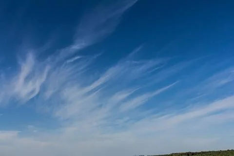 Ornamental clouds. Dramatic sky. Epic storm cloudscape Soft sunlight. Panoram Stock Photos