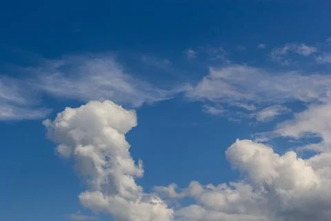 Ornamental clouds. Dramatic sky. Epic storm cloudscape Soft sunlight. Panoram Stock Photos