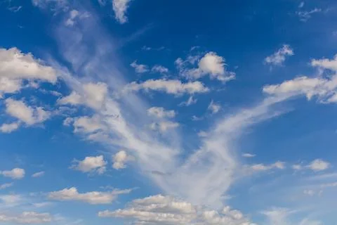 Ornamental clouds. Dramatic sky. Epic storm cloudscape Soft sunlight. Panoram Stock Photos