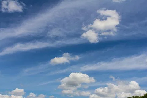 Ornamental clouds. Dramatic sky. Epic storm cloudscape Soft sunlight. Panoram Stock Photos