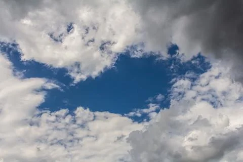 Ornamental clouds. Dramatic sky. Epic storm cloudscape Soft sunlight. Panoram Stock Photos