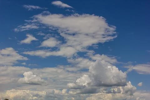 Ornamental clouds. Dramatic sky. Epic storm cloudscape Soft sunlight. Panoram Stock Photos