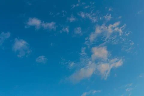 Ornamental clouds. Dramatic sky. Epic storm cloudscape Soft sunlight. Panoram Stock Photos