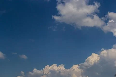 Ornamental clouds. Dramatic sky. Epic storm cloudscape Soft sunlight. Panoram Stock Photos