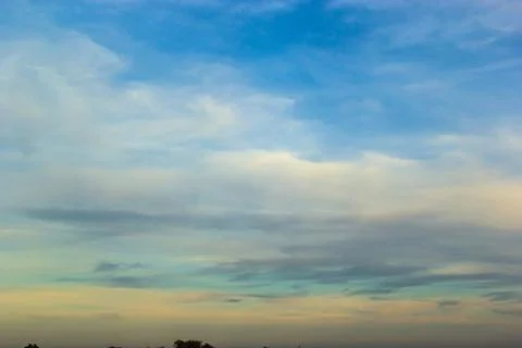 Ornamental clouds. Dramatic sky. Epic storm cloudscape Soft sunlight. Panoram Stock Photos