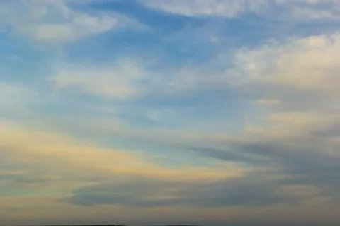 Ornamental clouds. Dramatic sky. Epic storm cloudscape Soft sunlight. Panoram Stock Photos