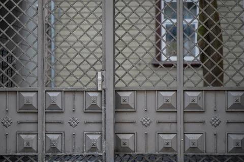 Ornamental iron gate with cross pattern grid Stock Photos