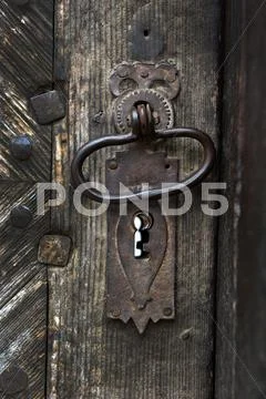 Ornamental Vintage Iron Door Handle On Wooden Door