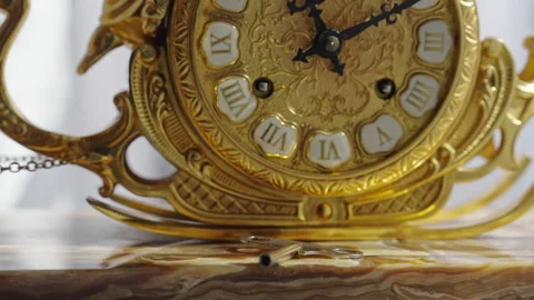 Ornate antique golden clock with rotating winding key Stock Footage 340508949