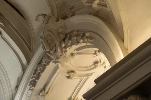 Ornate Baroque Ceiling Arch With Warm Gold Lighting and Decorative Plaster Mo Stock Photos