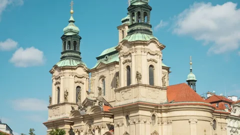 The ornate Baroque facade of St. Nicholas Church stands in central Prague. Stockbeeldmateriaal 341971331