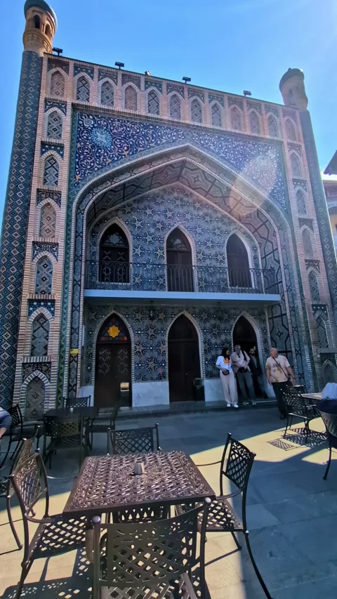 Ornate blue and turquoise ceramic tile patterns decorating the exterior wall of Stock Footage 335284852