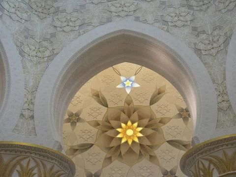 Ornate ceiling with intricate patterns and symmetrical design illuminated by Stock Photos