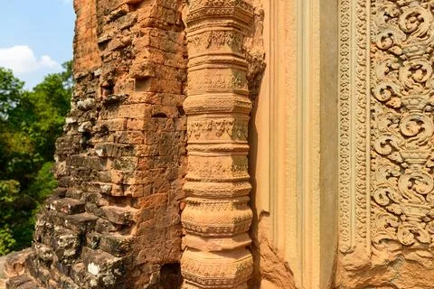 Ornate column and brickwork at Baksei Chamkrong Stock Photos