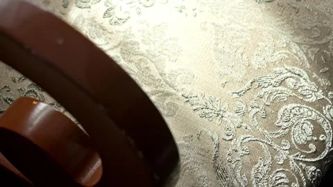 Ornate damask fabric with sunlight moving across Stock Footage 334942874
