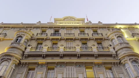 Ornate facade of the hermitage hotel in monte carlo, monaco, at dusk. Action Vídeos de archivo 306685819
