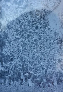 Ornate frost pattern on the window Stock Photos