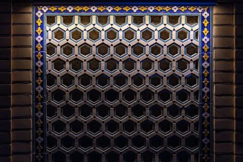 Ornate geometric wall tiling with hexagonal pattern Stock Photos