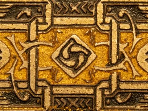 Ornate Gold Embossed Metal Pattern With Decorative Geometric Motifs And Vin.. Stock Photos