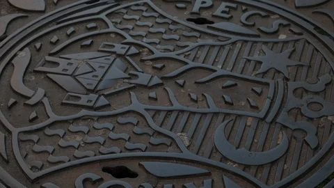 Ornate Manhole Cover in Pecs, Hungary (4k) Stock Footage