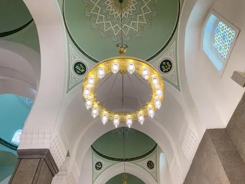 Ornate mosque interior ceiling with Islamic chandelier and decorative dome .. Stock Photos