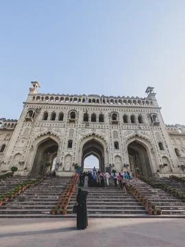 Ornate palace entrance with stone steps and visitors Stock Photos